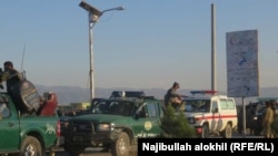 Afghan security force arrive near the site after a suicide bomber blew himself up inside a packed mosque on a base in Khost on November 23.