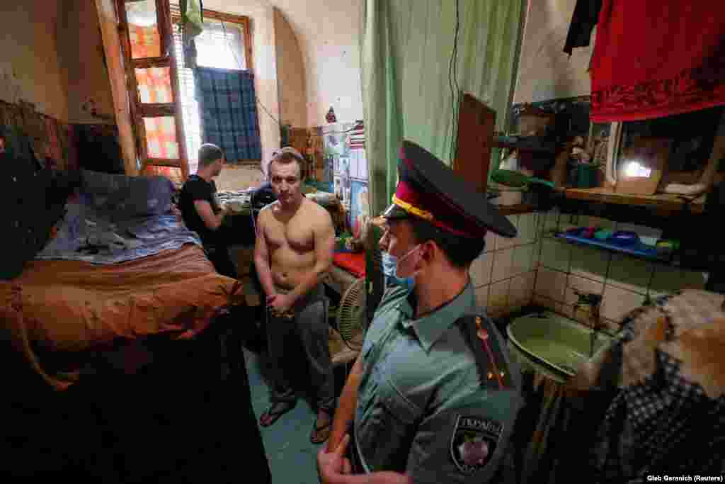 Detainees are seen in an old cell in a pretrial detention facility in Kyiv. (Reuters/Gleb Garanich)