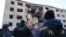 Ukrainian rescuers work at the site of a heavily damaged building following an air attack in Zaporizhzhya on October 30. 
