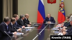 President Vladimir Putin chairs a meeting with members of Russia's Security Council at the Novo-Ogaryovo state residence outside Moscow on January 20.