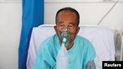 A patient suffering from COVID-19 receives treatment at Kabul's Afghan-Japan Hospital on June 15.