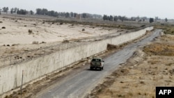 A military vehicle patrols in southeastern Iran next to the country's border with Afghanistan.