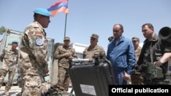 Afghanistan -- Armenia's Defense Minister Seyran Ohanian inspects Armenian troops near Kunduz, 24Jul2010.