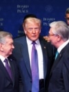 US President Donald Trump (center) with Uzbek President Shavkat Mirziyoev (left)and Kazakh President Qasym-Jomart Toqaev during the inaugural Board of Peace summit on February 19.