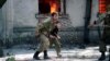 Abkhazia -- An Abkhaz militiaman evacuates a boy during the Abkhazian war. September 28, 1993