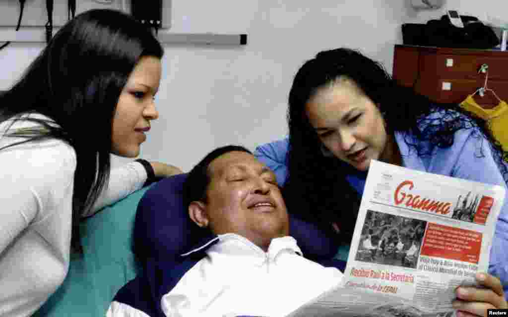 Chavez with his daughters Rosa (right) and Maria while recovering from cancer surgery in Havana in a photo dated February 15, 2013.