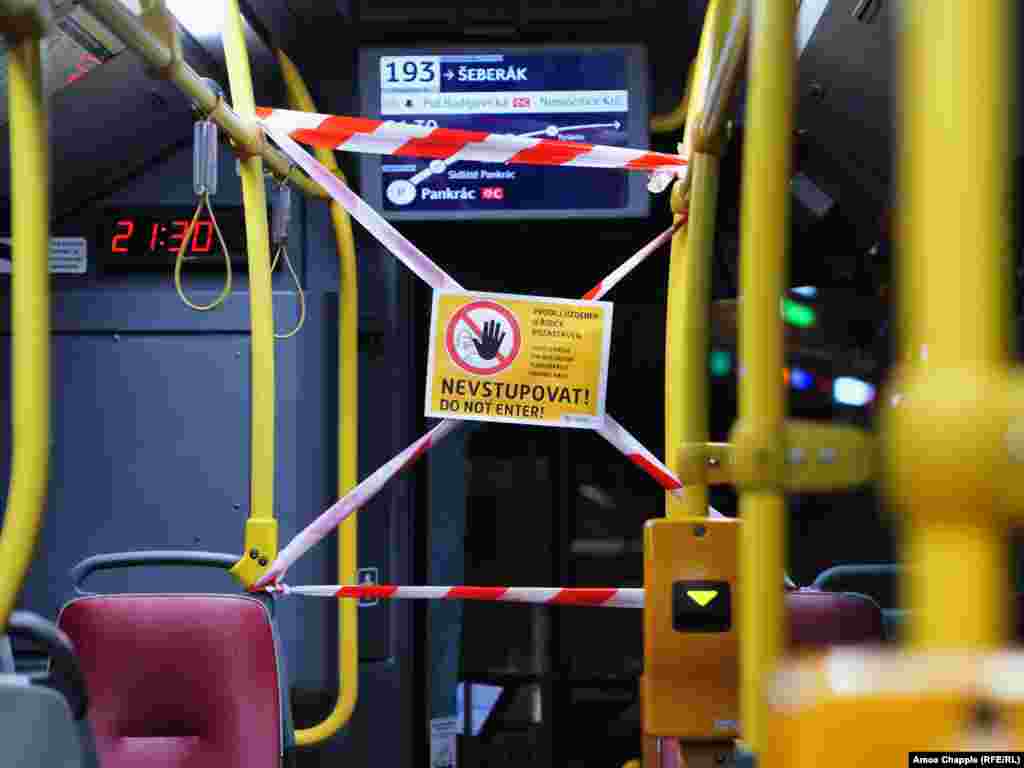 A sign blocking passengers from passing the driver inside a Prague bus.&nbsp;