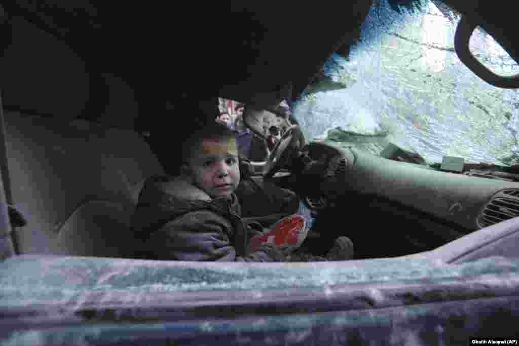 A boy cries after government air strikes in the town of Ariha, in Syria's Idlib Province. (AP/Ghaith Alsayed)