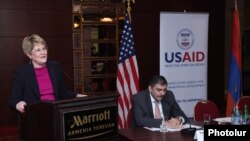 Armenia -- The USAID mission director for Armenia, Karen Hilliard, presents the agency's 5-year aid strategy, Yerevan, 11Dec2013.