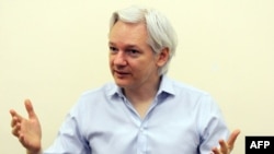 WikiLeaks founder Julian Assange speaks to the media inside the Ecuadorian Embassy in London in June 2013.