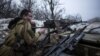 A pro-Russia separatist fires his machine gun toward Ukrainian Army positions near Debaltseve in late January 2015.