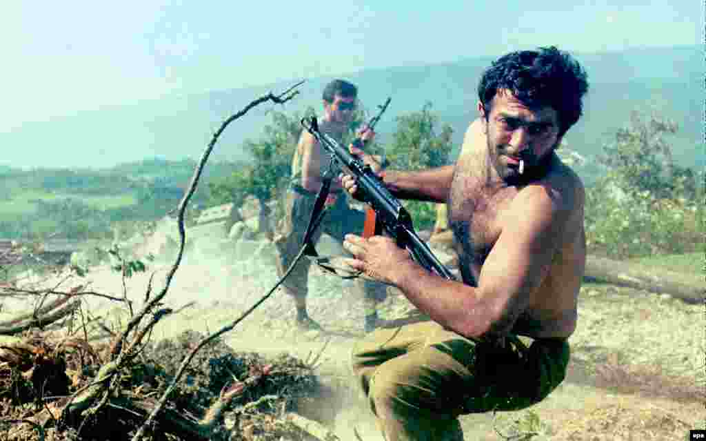 Abkhaz fighters retreat shortly before a Russian-brokered cease-fire was declared.