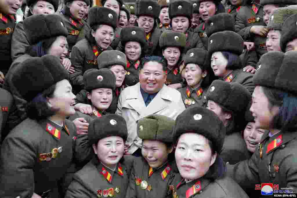 North Korean leader Kim Jong Un poses for a photo with members of a women&#39;s company under Unit 5492 of the Korean People&#39;s Army stationed at a remote seaside base in the country&#39;s southwest. (epa-EFE/KCNA)
