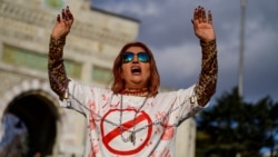 A woman wears a T-shirt bearing the word "Execution" in Persian as she takes part in a rally in Istanbul, Turkey, in November 2022.