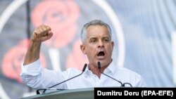 The leader of Moldova's Democratic Party Vladimir Plahotniuc gestures during a rally in Chisinau on June 9. 