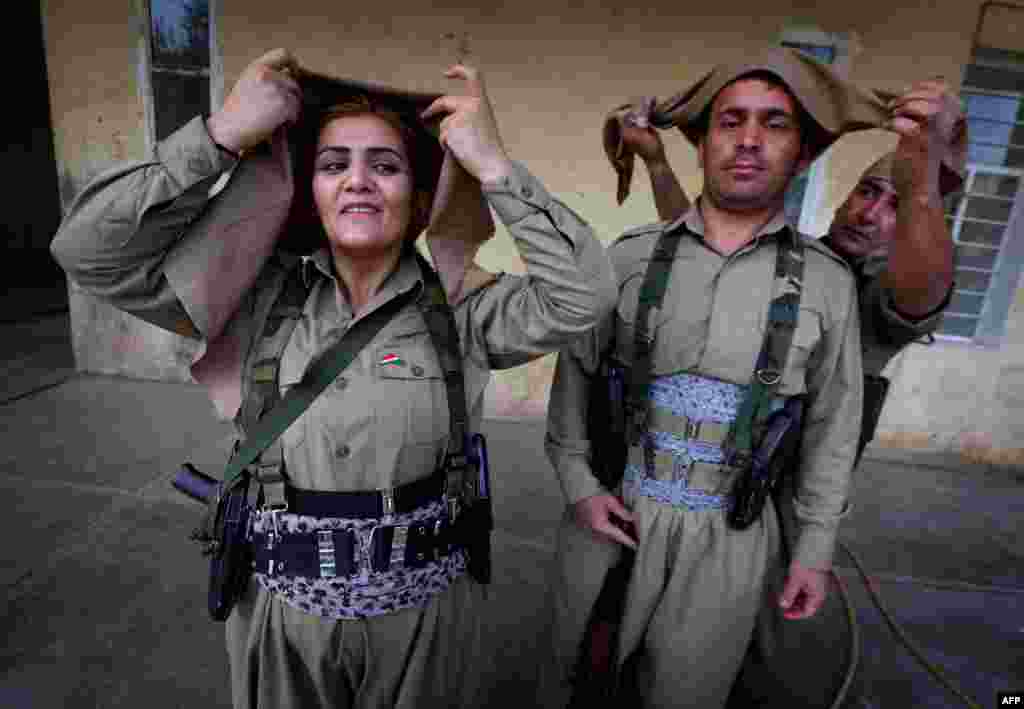 Iranian Kurdish Peshmerga members prepare for military exercises in Koya, 100 kilometers north of Irbil, Iraq. (AFP/Safin Hamed)