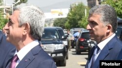 Armenia - President Serzh Sarkisian (L) and his chief bodyguard Vachagan Ghazarian, 11 July 2015.