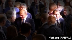 Sergei Lushnikov (right) pictured beside Russian President Vladimir Putin