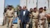 Iraqi Prime Minister Nuri al-Maliki tours military posts on the outskirts of Baghdad on August 6. Can Maliki rise above sectarian divisions to finally unite Iraq?