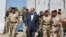 Iraqi Prime Minister Nuri al-Maliki tours military posts on the outskirts of Baghdad on August 6. Can Maliki rise above sectarian divisions to finally unite Iraq?