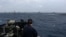 A US sailor aboard the guided-missile destroyer USS Frank E. Petersen Jr. is shown in photo released by US Central Command.  