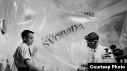 Two RFE/RL employees prepare balloons which will carry leaflets into Czechoslovakia. (1951)