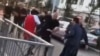 A screen grab from a video showing a number of white men confronting and attacking black students outside a sports field in Tbilisi's Digomi neighborhood on April 8.