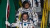 Российский космонавт Михаил Тюрин и японский астронавт Коити Ваката перед стартом. 7 ноября 2013 г