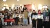 Afghan journalists hold the pictures colleagues killed in recent years (file photo, November 2014)