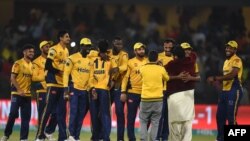 Cricketers of Peshawar Zalmi celebrate after winning the Twenty20 cricket match of the Pakistan Super League against Karachi King in Lahore last March. ALI