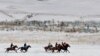 KYRGYZSTAN -- Mounted Kyrgyz riders play the traditional central Asian sport Kok-boru, know also as Buzkashi or Ulak Tartis ("goat grabbing"), near the village of Besh-Kungey, some 20km from Bishkek, February 4, 2018