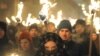 Marchers hold torches during a march in Lviv on January 1, 2016, as they mark the 107th anniversary of the birth of Stepan Bandera, a Ukrainian politician and one of the leaders of Ukrainian national movement in western Ukraine. (AFP/Yuriy Dyachyshyn)