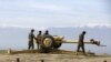 FILE: Afghan National Army (ANA) soldiers clean an artillery at a hilltop in Baghlan Province.