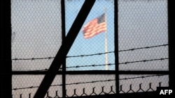 The U.S. flag flies over the war crimes courtroom in Camp Justice at the U.S. Naval Base in Guantanamo Bay.