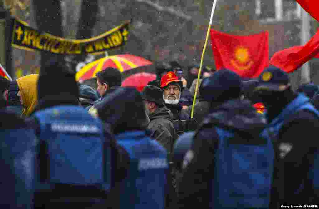 Macedonians demonstrate in front of the parliament building in Skopje on January 9. They were protesting a plan to rename the country as North Macedonia. The compromise with Greece, which took effect a month later, was seen as a key to the country&#39;s ambition to join NATO and the European Union. (epa-EFE/Georgi Licovski)
