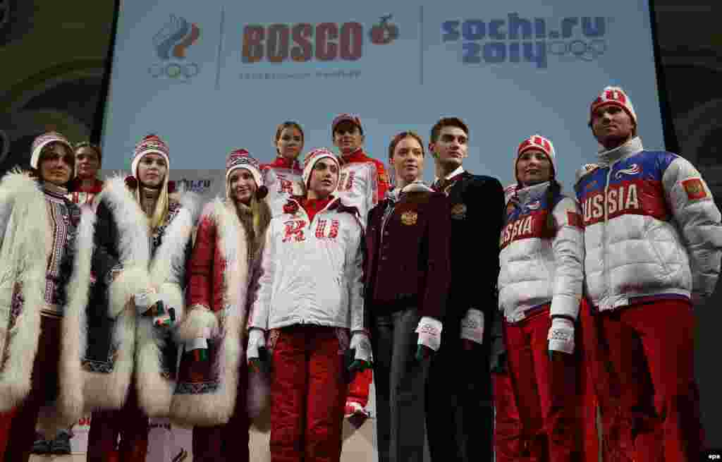 Russian athletes pose for the press in Moscow during the presentation of the uniforms for the Russian national Olympic team.