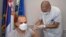 The Serbian health minister receives a dose of the Chinese-made Sinopharm vaccine in Belgrade on January 19.
