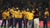 Cricketers of Peshawar Zalmi celebrate after winning the Twenty20 cricket match of the Pakistan Super League against Karachi King in Lahore last March. ALI