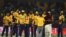 Cricketers of Peshawar Zalmi celebrate after winning the Twenty20 cricket match of the Pakistan Super League against Karachi King in Lahore last March. ALI