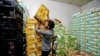 A man carries a box of Iranian dates in Baghdad, Iraq March 14, 2018. Picture taken March 14, 2018. REUTERS/Khalid al-Mousily