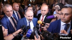 Prime Minister Nikol Pashinian talks to reporters in Yerevan on October 1.