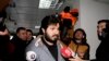 TURKEY -- Turkish-Iranian businessman Reza Zarrab, who is charged currently in the U.S. for evading sanctions on Iran, is surrounded by the media members as he arrives at a courthouse in Istanbul, December 17, 2013 