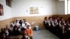 Afghan schoolchildren attend a class at the Shahid Nasseri refugee camp in Taraz Nahid village near the city of Saveh, some 130 kms southwest of the capital Tehran, on February 8, 2015.