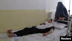 A schoolgirl receives treatment at a hospital after being poisoned in Takhar Province on May 23.