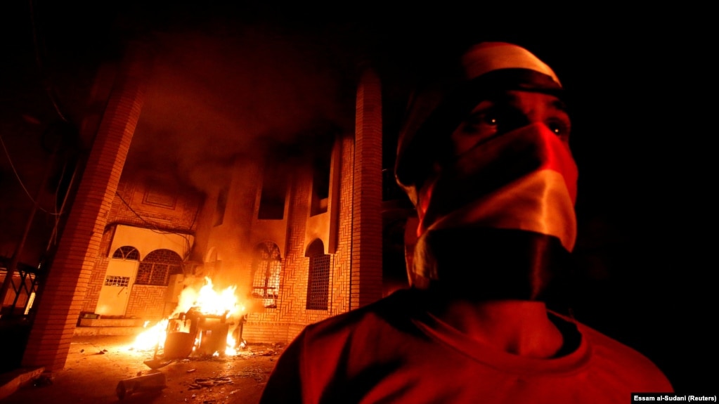 A protester involved in the torching of the Iranian Consulate in Basra on September 7