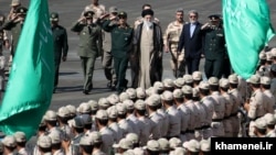 Supreme Leader Ayatollah Ali Khamenei walks alongside military officials, during a gradation ceremony at Tehran's police academy on September 17.