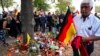 Right-wing protesters light candles during a protest in Koethen, Germany, on September 16.