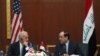U.S. Vice President Joe Biden (left) and Iraqi Prime Minister Nuri al-Maliki speak at a joint news conference in Baghdad on November 30.
