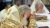 Greece -- Religious Orthodox Christians leaders pray inside a church in Heraklion on the Greek island of Crete, June 19, 2016