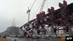 The first section of a colossal arch-shaped structure that will eventually cover the exploded reactor at the Chornobyl nuclear power station.